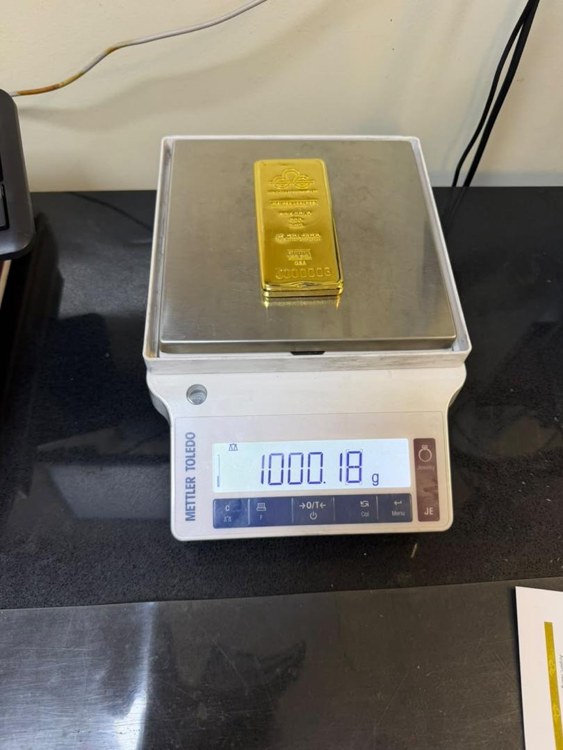 Gold bar on a digital balance